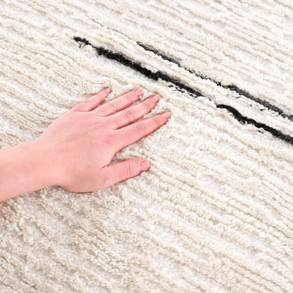 Riad Black Striped White Area Rug with tassels